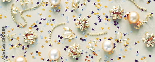 Christmas background banner. New Year decorations pattern in gold colors on g...