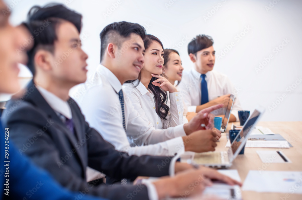 side view of Corporate business team in meeting side view of Corporate business team in meeting