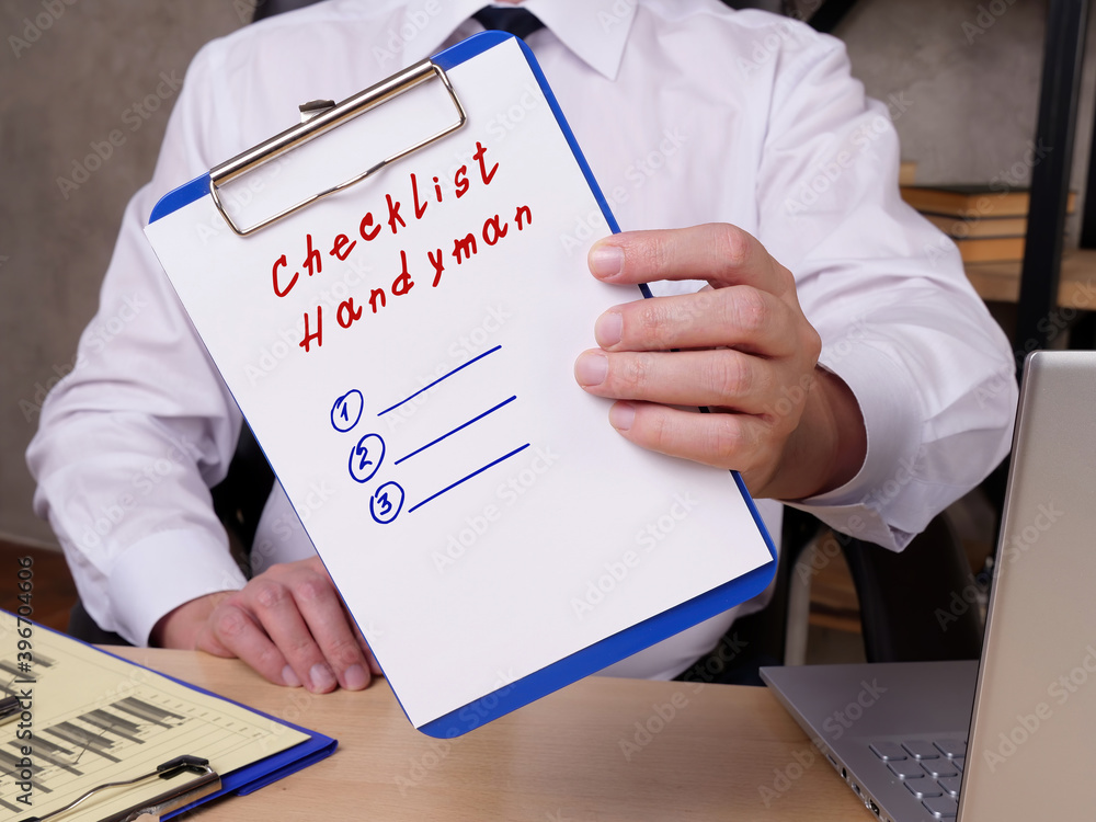 Financial concept meaning Checklist Handyman with phrase on the sheet. Financial concept meaning Checklist Handyman with phrase on the sheet.