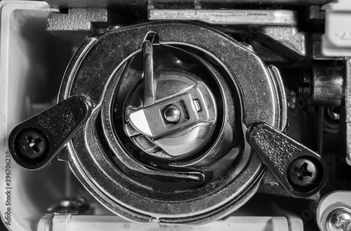 Parts of a household sewing machine close-up. photo