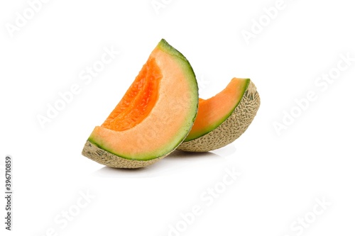 Close up of fresh melon slice isolated on white background. Nature vegetarian health & fruit photo concept