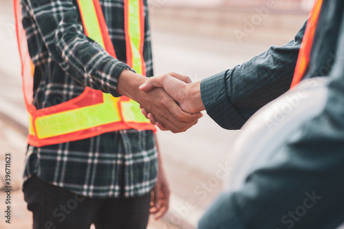 Close up people shake hand outdoor success construction © Suriyo