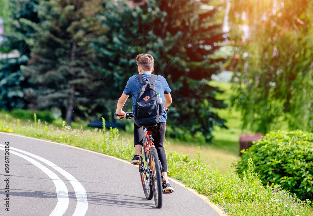 Cyclist ride on the bike path in the city Park
