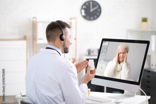 Male doctor giving a consul...