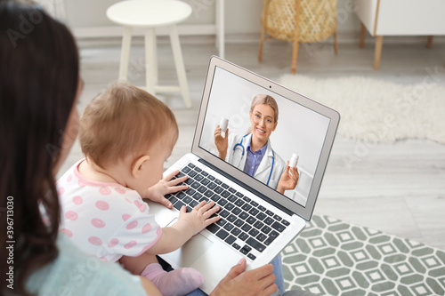 Young woman with her baby g...