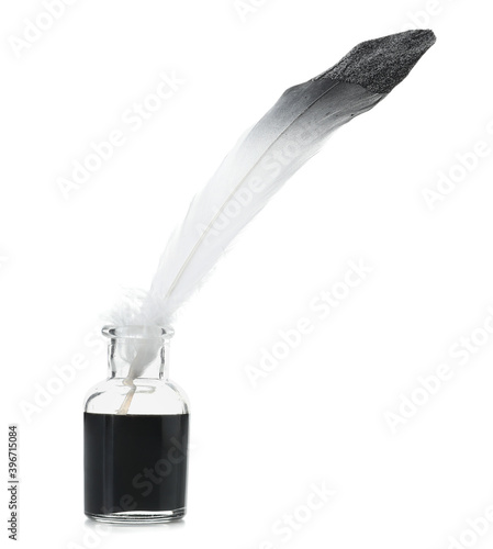 Feather pen and inkwell on ...
