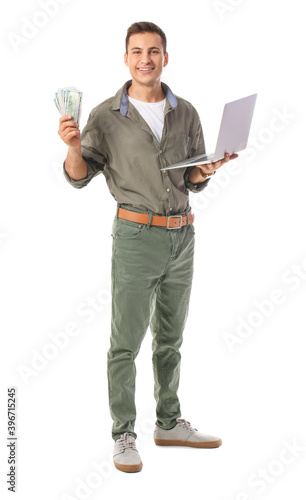Young man with laptop and m...
