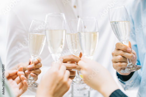 Group Asian business people are having a toast together and chatting at a company party