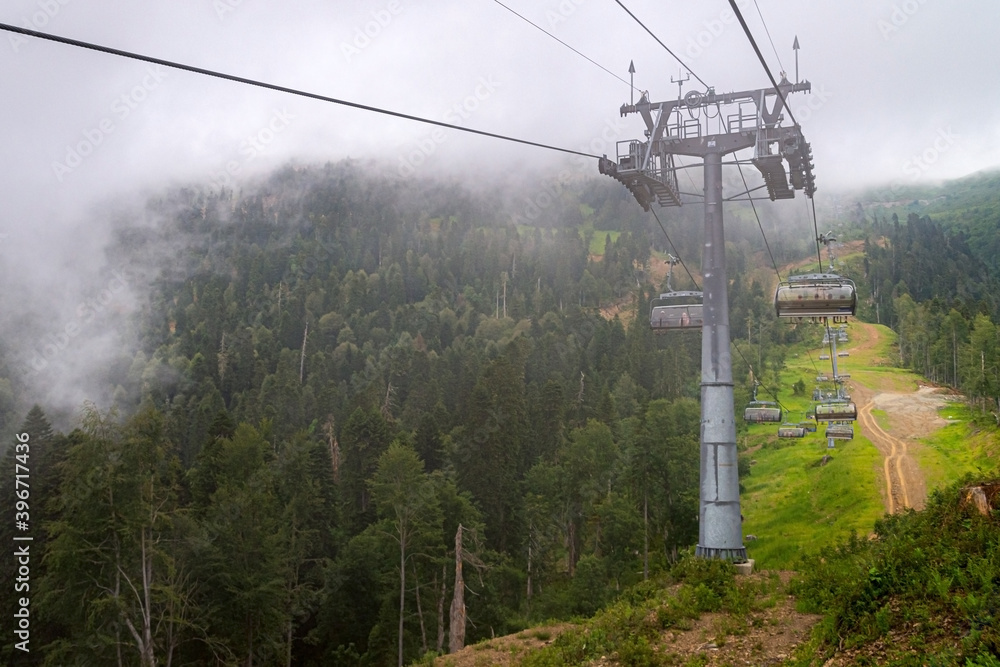 Chairlift in a mountain region in summer. Life of ski resort in summertime