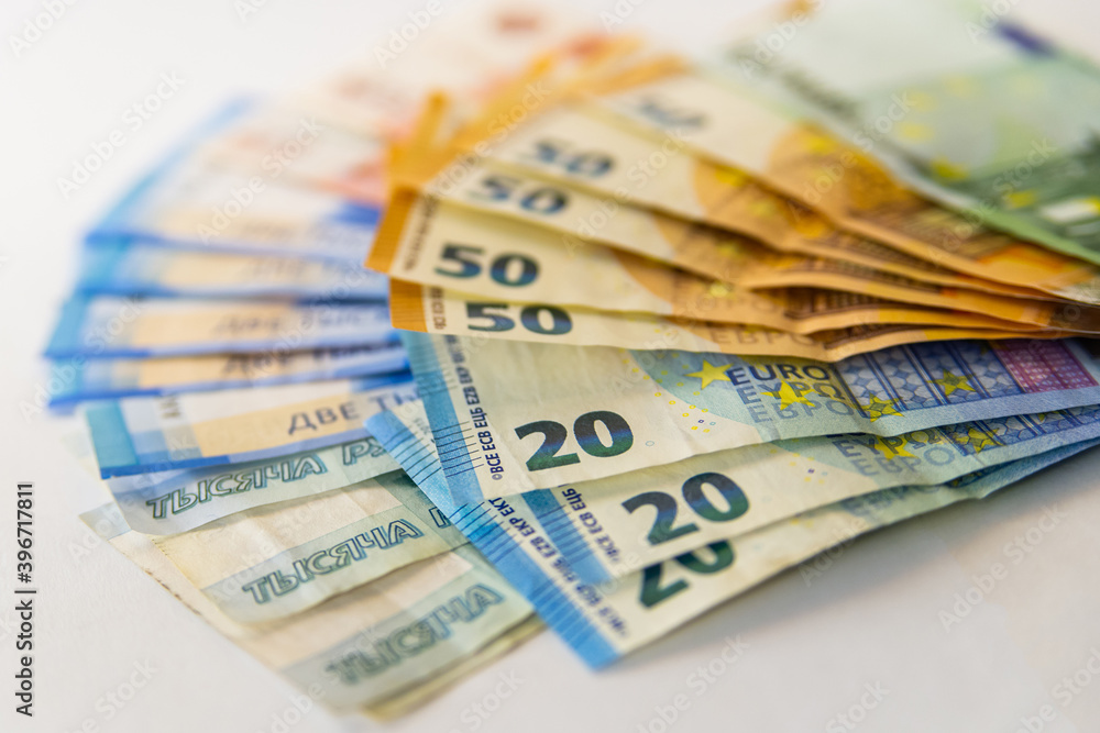 Background of euro banknotes and Russian rubles. Currency rate Background of euro banknotes and Russian rubles. Currency rate