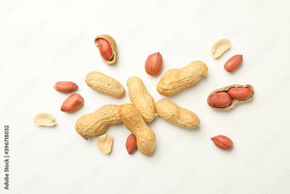 Tasty peanuts on white background, top view Tasty peanuts on white background, top view
