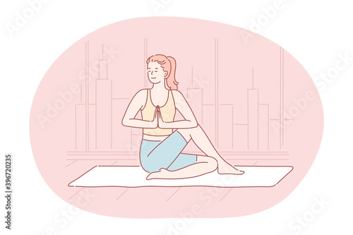 Yoga, meditation, healthy active sport lifestyle concept. Young smiling woman in sportswear sitting in asana on fitness mat, practicing yoga, relaxing and meditating. Fitness, relax, harmony, peace