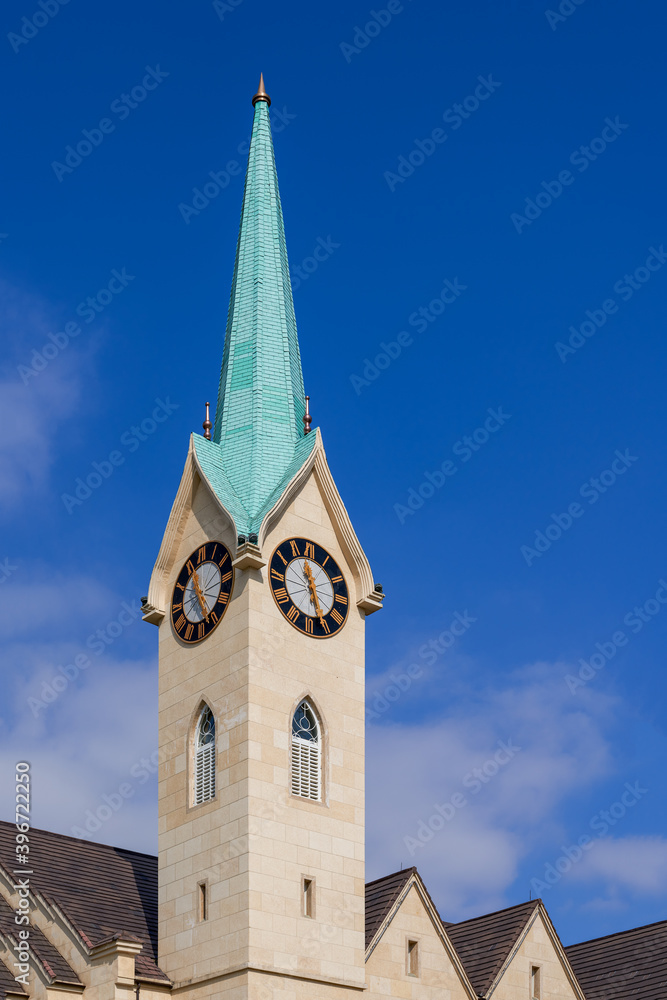 Full view and partial close-up of European-style steeple church, Gothic architecture