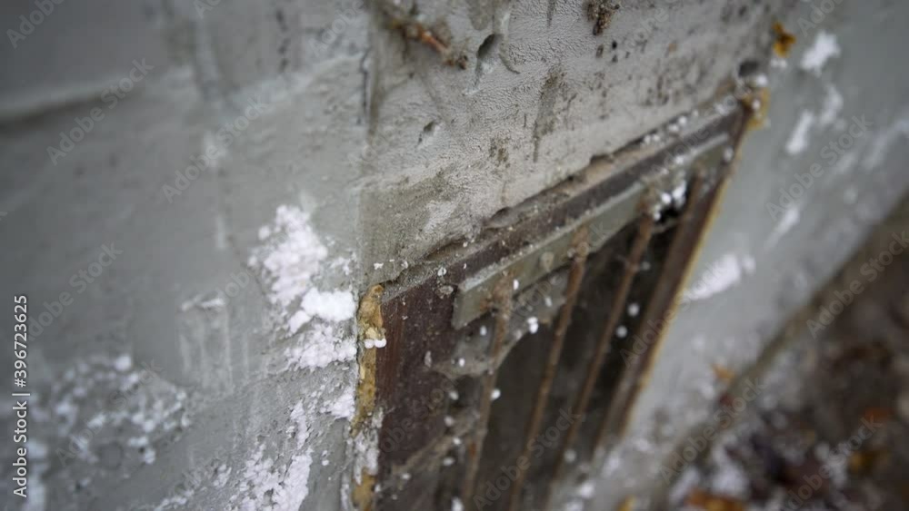 Close up of window on old concrete building Close up of window on old concrete building