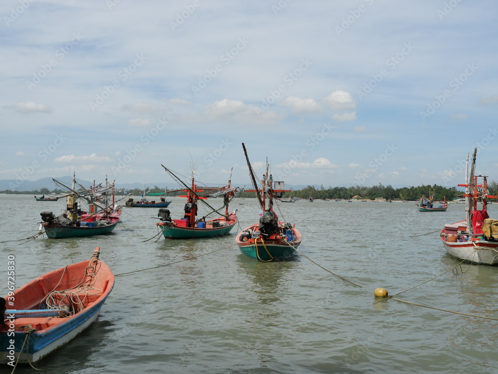 Trawler and Fishing boat at sea with mountain and the island at Prachuap Bay, Prachuap Khiri Khan, Thailand Trawler and Fishing boat at sea with mountain and the island at Prachuap Bay, Prachuap Khiri Khan, Thailand