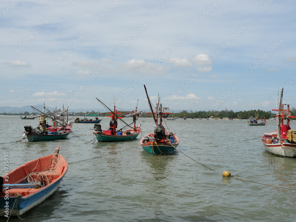 Trawler and Fishing boat at sea with mountain and the island at Prachuap Bay, Prachuap Khiri Khan, Thailand