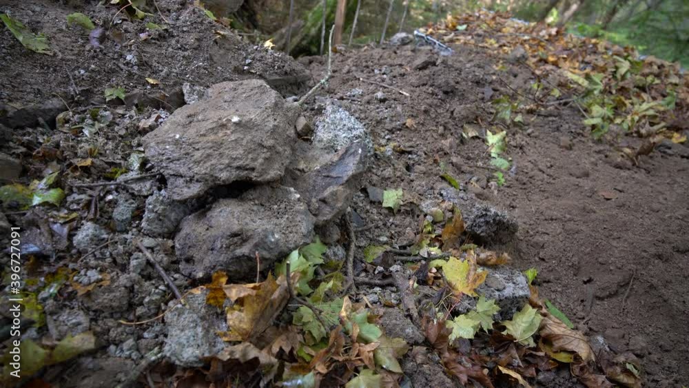 Rock thrown on the pile of rocks Rock thrown on the pile of rocks