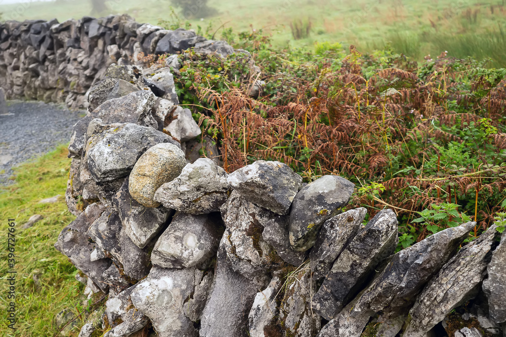 Traditional dry stone fence. Fine example of stone mason craft and skill. Nobody