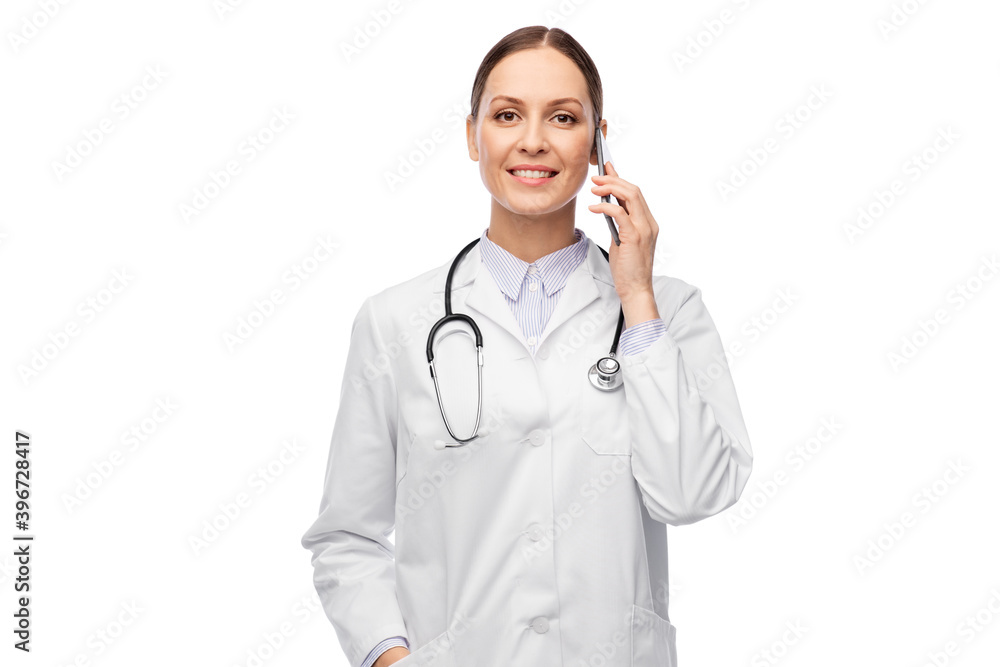 medicine, profession and healthcare concept - happy smiling female doctor with stethoscope calling on smartphone over white background medicine, profession and healthcare concept - happy smiling female doctor with stethoscope calling on smartphone over white background