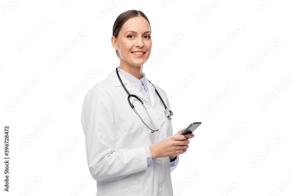 medicine, profession and healthcare concept - happy smiling female doctor with stethoscope using smartphone over white background medicine, profession and healthcare concept - happy smiling female doctor with stethoscope using smartphone over white background