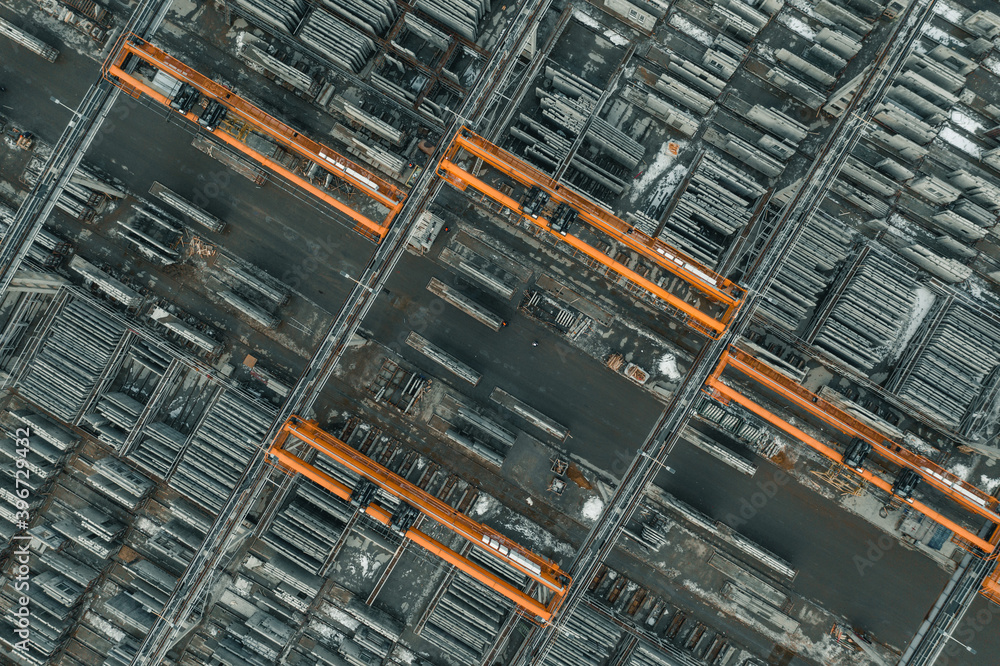 Bridge crane in the factory, overhead crane moves in large warehouse