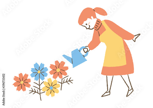 花に水をかける女性