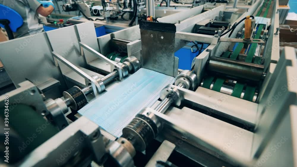 Medical mask sorting machine at a face mask production factory Medical mask sorting machine at a face mask production factory