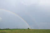 Rainbow lights form in the sky, farmland in rural areas.