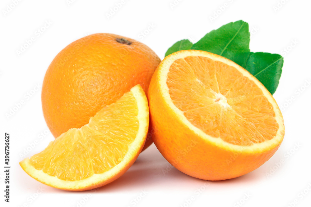 Orange fruit with orange slices and leaves isolated on white background. Orange fruit with orange slices and leaves isolated on white background.