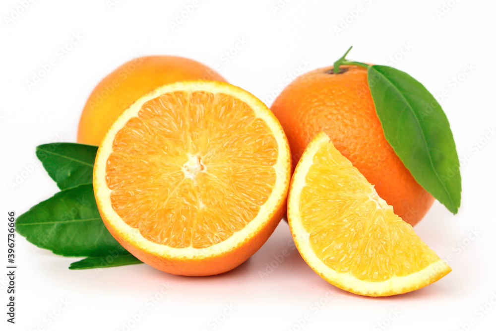 Orange fruit with orange slices and leaves isolated on white background. Orange fruit with orange slices and leaves isolated on white background.