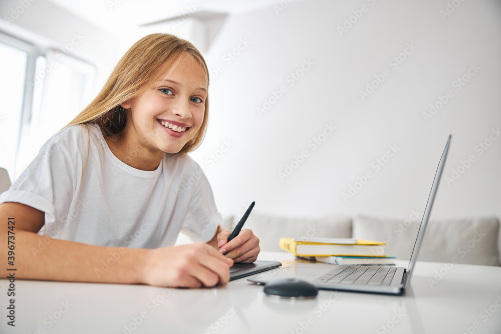 Young digital artist smiling at the camera Young digital artist smiling at the camera