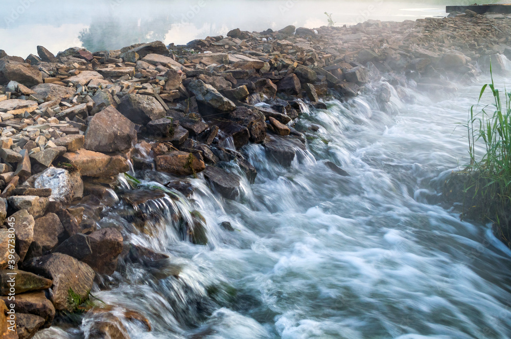Falling water from stone path