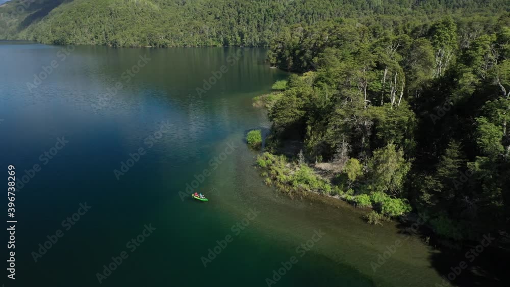 Dolly in of a couple of proffesional dry fly fishers in a kayak catching trouts in Lake Steffen, Patagonia Argentina. Dolly in of a couple of proffesional dry fly fishers in a kayak catching trouts in Lake Steffen, Patagonia Argentina.
