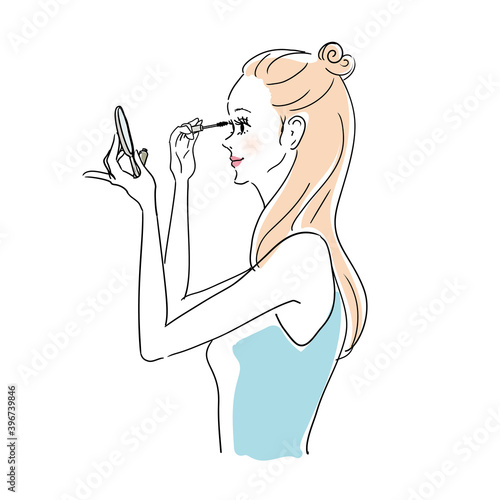 メイク中の女性　マスカラ