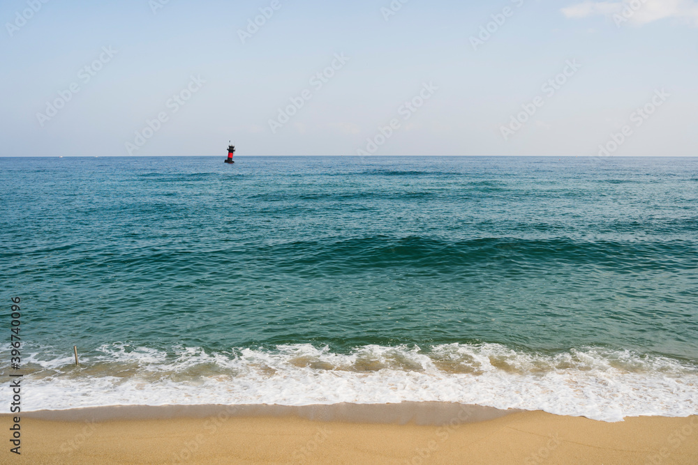 calm waves, waves and lighthouses along Gyeongpo Beach.