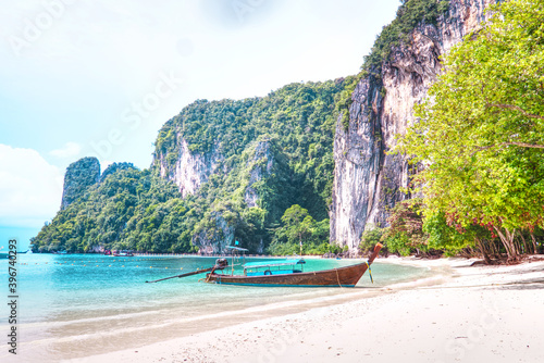 Long tail boat park on the beach with have turquoise sea blue sky at Koh Hong lagoon,Krabi south of Thailand.