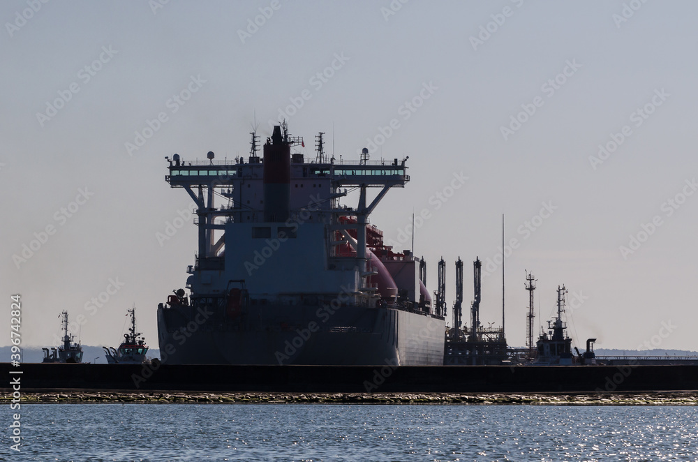 LNG TANKER - Ship and tugs are maneuvering at the gas terminal in Swinoujscie LNG TANKER - Ship and tugs are maneuvering at the gas terminal in Swinoujscie