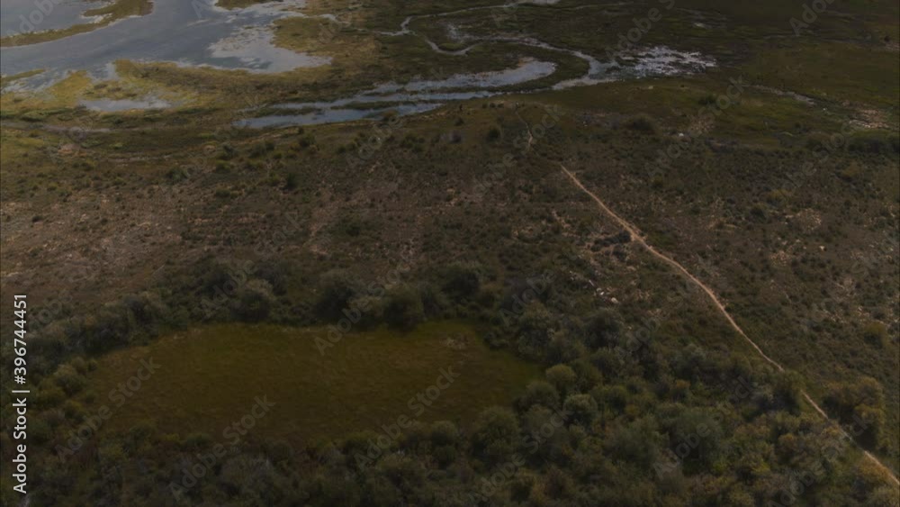 Aerial shot of open field and mountains in Colorado