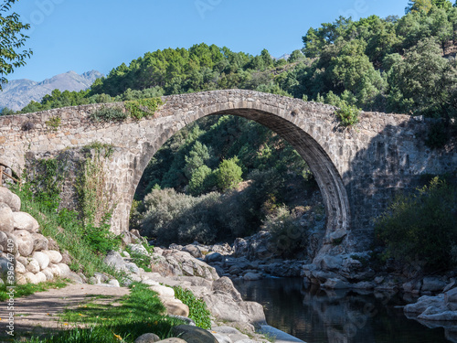 Roman bridge over the canyon of the Alardos river. Madrigal de la Vera, Caceres, Extremadura, Spain photo