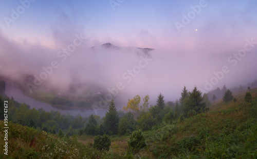 Purple fog before sunrise at Stryi river photo
