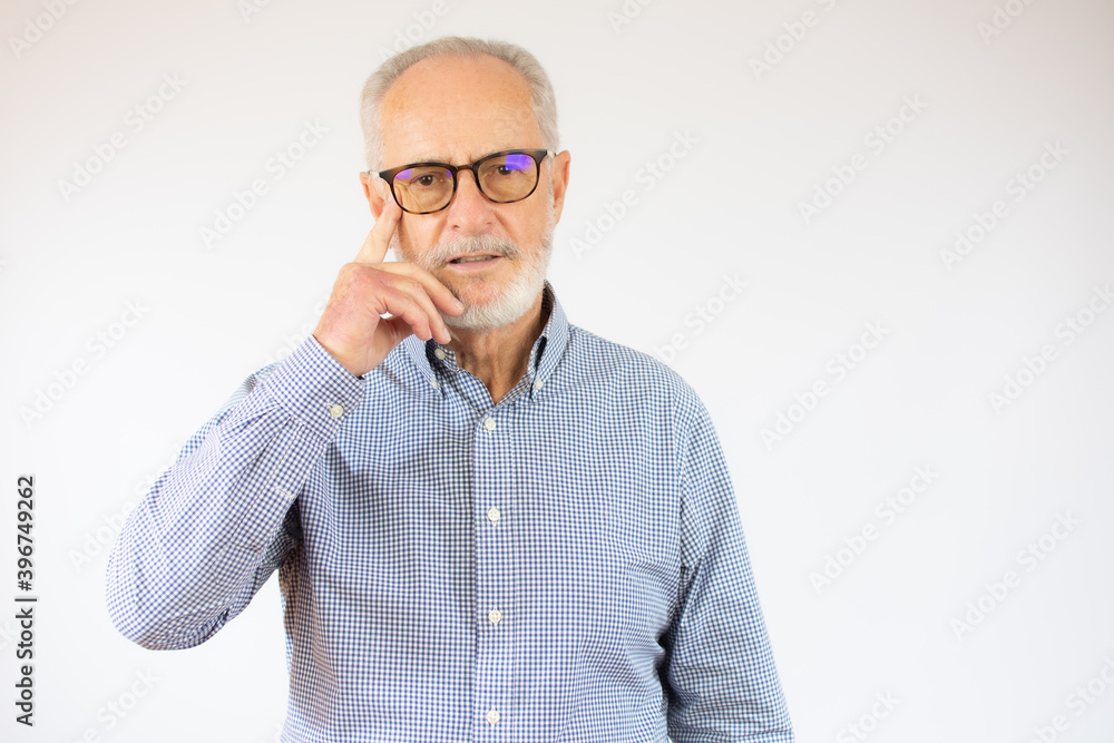Grey haired senior man wearing casual shirt standing over white background clueless and confused with open arms, no idea concept. Grey haired senior man wearing casual shirt standing over white background clueless and confused with open arms, no idea concept.