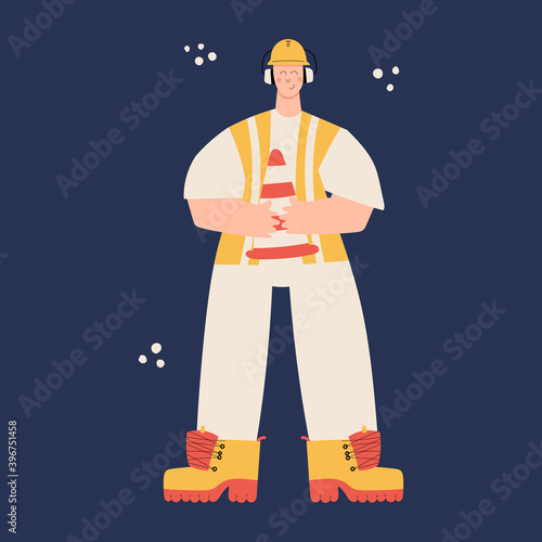 Road Construction or factory worker wearing hard hat, earmuffs, high visibility vest, work clothing and boots. Worker with traffic safety cone. Health and safety at work. PPE
