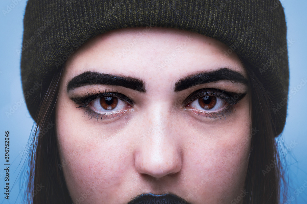 Close-up of a gothic girl looking straight ahead. Close-up of a gothic girl looking straight ahead.