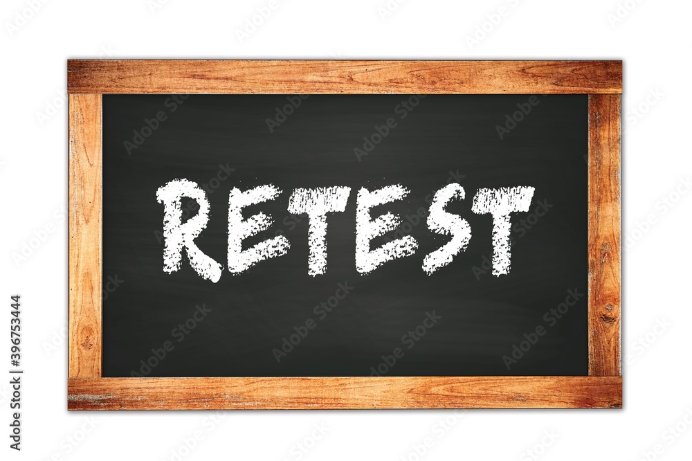 RETEST text written on wooden frame school blackboard. RETEST text written on wooden frame school blackboard.