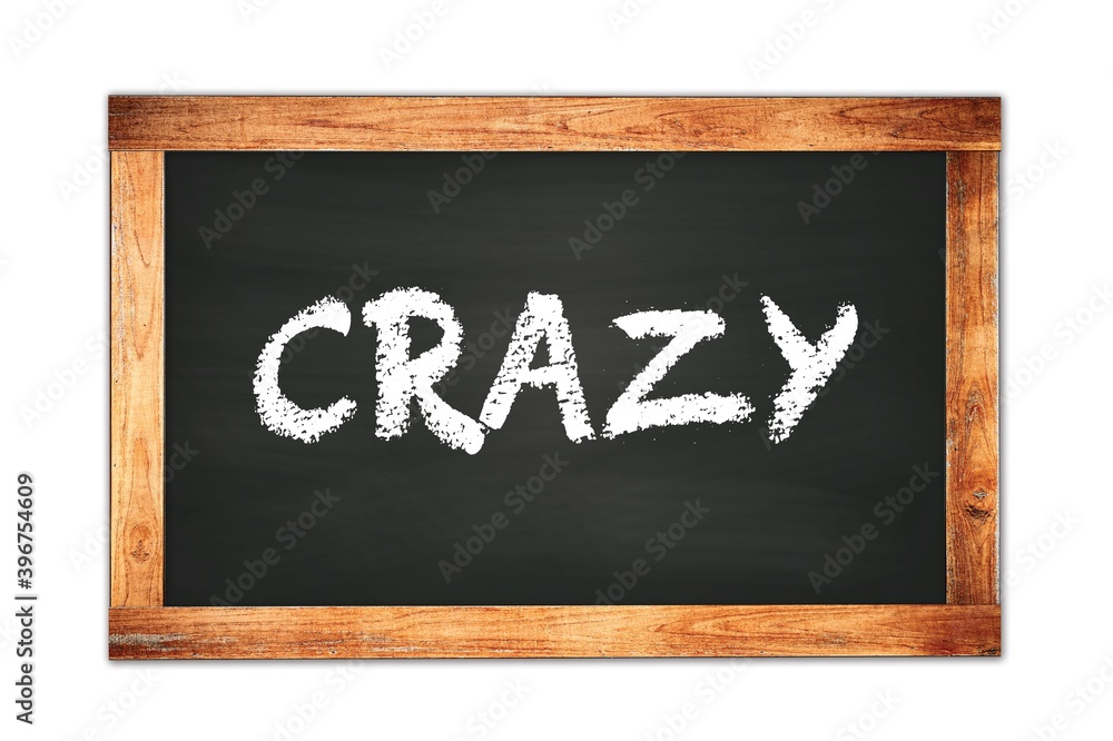 CRAZY text written on wooden frame school blackboard. CRAZY text written on wooden frame school blackboard.
