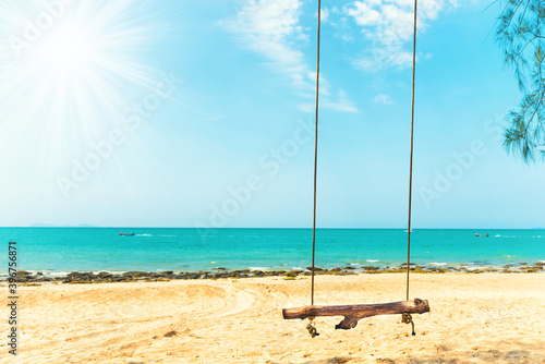 Swing on sand beach at tropical island. Tropical nature landscape © Pavlo Vakhrushev