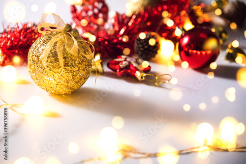 Christmas decoration balls and ornaments over abstract bokeh background on white background. Holiday background greeting card for Christmas and New Year. Merry Christmas