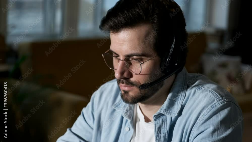 A man uses a computer works at home, businessman working on desk at home A man uses a computer works at home, businessman working on desk at home