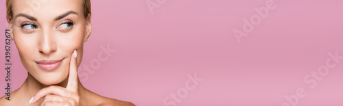 фотографія dreamy beautiful blonde woman with perfect skin isolated on pink, banner