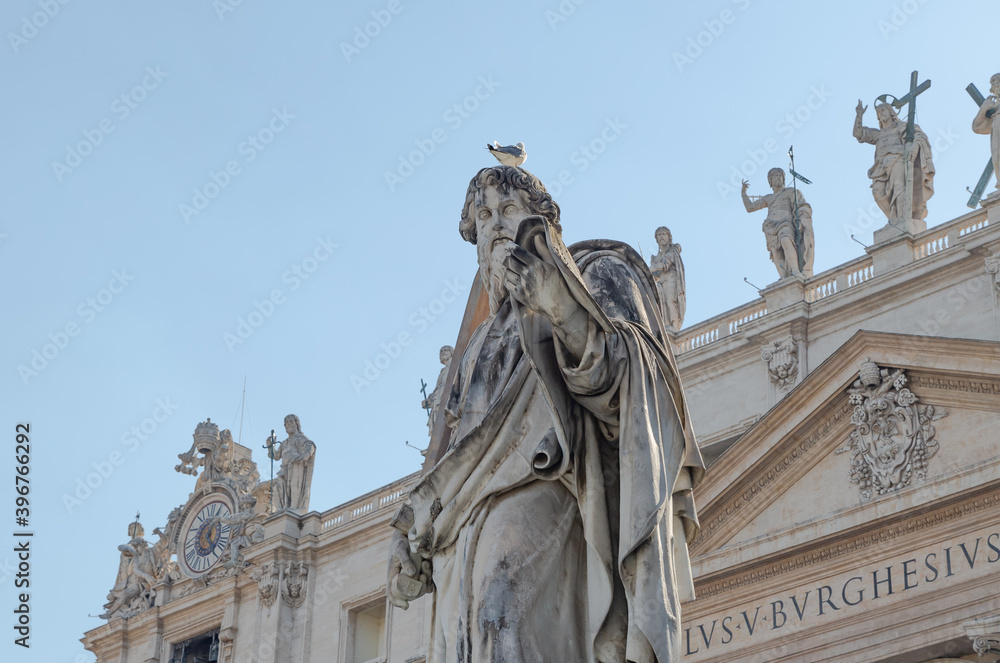Statue of St. Paul outside the basilica of Saint Peter the Basilica facade Vatican City, Rome, Italy
